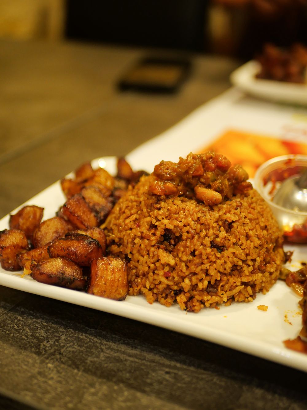 Jollof rice with fried plantain.